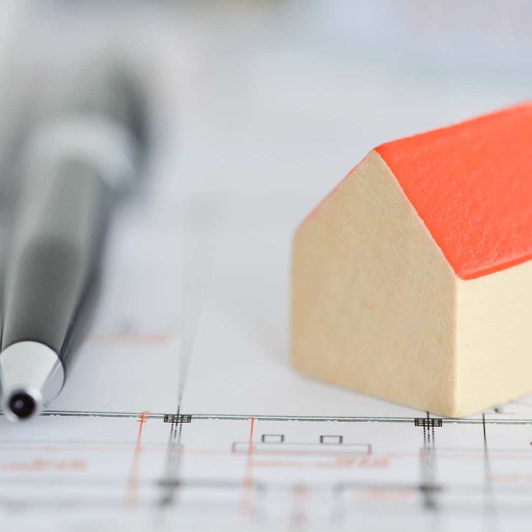 A small house next to a pen