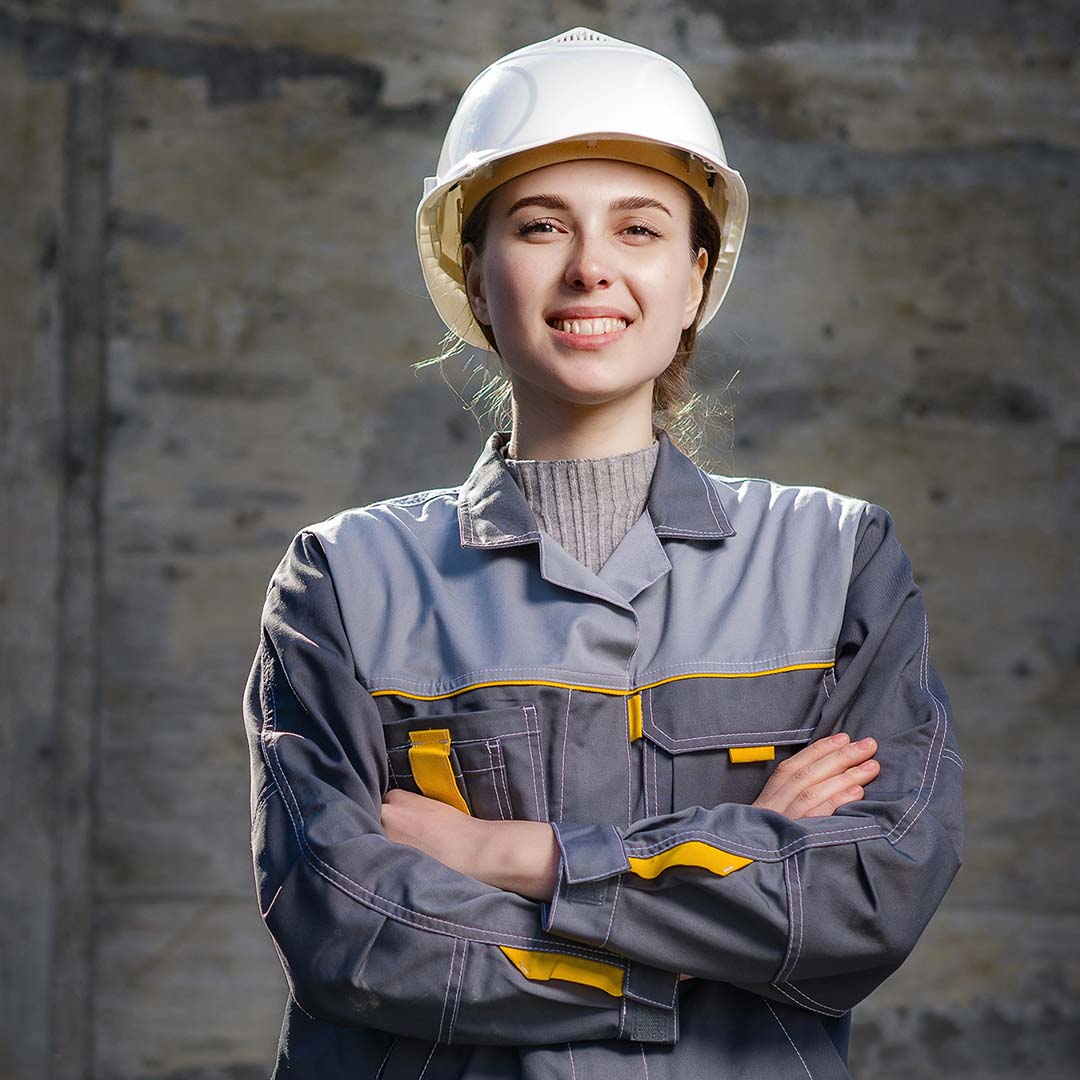 A female construction worker smiling