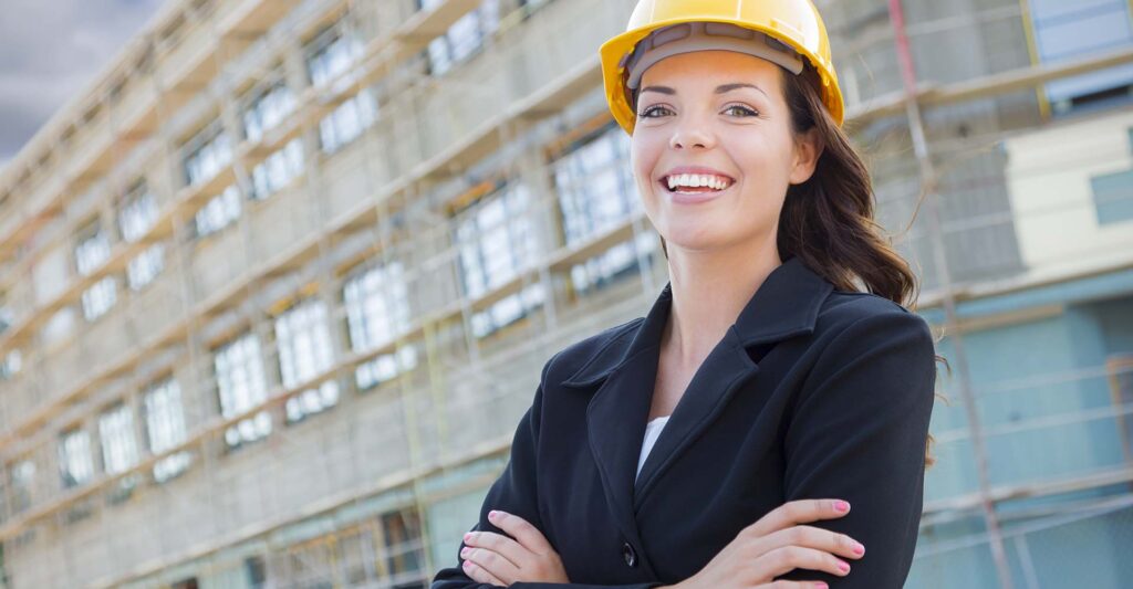 A female construction worker smiling